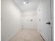 Laundry room with tile floors, utility sink hook-ups and overhead shelving at 26 Hemlock Terrace Dr, Ocala, FL 34472
