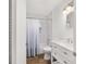 Modern bathroom with a shower-tub combo and white vanity at 2602 Ne 2Nd Ave, Ocala, FL 34470