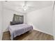 Bright bedroom with hardwood floors and large window at 2602 Ne 2Nd Ave, Ocala, FL 34470