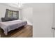 Bright bedroom with hardwood floors and a large window at 2602 Ne 2Nd Ave, Ocala, FL 34470