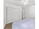 Bedroom features hardwood floors and a spacious closet at 2602 Ne 2Nd Ave, Ocala, FL 34470