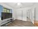 Neutral bedroom featuring hardwood floors, white walls, a ceiling fan, and closet at 2602 Ne 2Nd Ave, Ocala, FL 34470