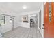 Inviting entryway with tile flooring and a view into the living spaces of this home at 2602 Ne 2Nd Ave, Ocala, FL 34470