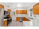 Bright kitchen with stainless steel appliances, marble countertops, and tile flooring at 2602 Ne 2Nd Ave, Ocala, FL 34470