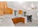 Open concept kitchen features marble countertops, wooden cabinetry, and tile flooring at 2602 Ne 2Nd Ave, Ocala, FL 34470