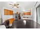 Open concept kitchen features stainless steel appliances and ample wooden cabinetry at 2602 Ne 2Nd Ave, Ocala, FL 34470