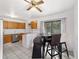 Functional kitchen with wood cabinetry, stainless steel appliances, and a breakfast nook for casual dining at 2602 Ne 2Nd Ave, Ocala, FL 34470