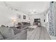 Inviting living room with gray sofas, tile flooring, and modern decor, perfect for relaxing and entertaining guests at 2602 Ne 2Nd Ave, Ocala, FL 34470