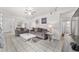 Spacious living room with neutral tones, tile floors, and ample seating, creating a welcoming atmosphere at 2602 Ne 2Nd Ave, Ocala, FL 34470