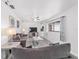 Bright and airy living room featuring comfortable seating, tile floors, and a large window for natural light at 2602 Ne 2Nd Ave, Ocala, FL 34470
