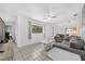 Comfortable living area with tiled floor, plush seating, and bright white walls creating an open and airy ambiance at 2602 Ne 2Nd Ave, Ocala, FL 34470
