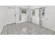 Bright room featuring tile floors, plenty of natural light, and modern curtains at 2602 Ne 2Nd Ave, Ocala, FL 34470