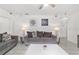 Well-lit living room showcasing cozy sofas, stylish decor, and a ceiling fan for added comfort at 2602 Ne 2Nd Ave, Ocala, FL 34470