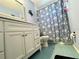 Cozy bathroom featuring a vanity, toilet, and shower/tub combination at 3525 E Fort King St # 140, Ocala, FL 34470