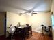 Bright dining room with a ceiling fan, a table with four chairs, and wood flooring at 3525 E Fort King St # 140, Ocala, FL 34470