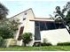 A unique angle showcases this home's architecture, screened in porch, lush landscaping, and potential for serene outdoor living at 3525 E Fort King St # 140, Ocala, FL 34470