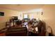 Expansive living area with hardwood floors, multiple seating options, and bright lighting at 3525 E Fort King St # 140, Ocala, FL 34470
