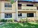 Two story building with balconies and manicured landscaping at 3525 E Fort King St # 145, Ocala, FL 34470