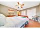 Bedroom with hardwood floors, a ceiling fan and two windows with bright natural light at 3831 Se 48Th St, Ocala, FL 34480