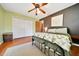 Bedroom with a ceiling fan, a large closet and a cool accent wall at 3831 Se 48Th St, Ocala, FL 34480
