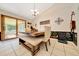 Bright dining area featuring a modern table with bench seating and sliding doors at 3831 Se 48Th St, Ocala, FL 34480