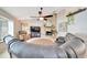 Bright living room with stone fireplace, ceiling fan, and comfortable seating area at 3831 Se 48Th St, Ocala, FL 34480