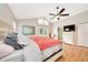 Bright main bedroom with hardwood floors, a ceiling fan and French doors to the backyard at 3831 Se 48Th St, Ocala, FL 34480