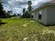 A spacious backyard with a lush green lawn, offering plenty of room for outdoor activities at 3858 Sw 161St St, Ocala, FL 34473