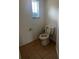 Tiled half-bathroom features a single window offering natural light at 3858 Sw 161St St, Ocala, FL 34473