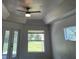 Bedroom featuring a ceiling fan and tray ceiling for added height and style at 3858 Sw 161St St, Ocala, FL 34473
