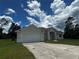 Charming single-story home with a two-car garage and a well-maintained lawn at 3858 Sw 161St St, Ocala, FL 34473