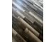 Dark gray hardwood flooring that offers a modern and stylish look at 3858 Sw 161St St, Ocala, FL 34473