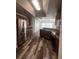 Galley kitchen features stainless steel appliances, wood cabinets, wood flooring and recessed lighting at 3858 Sw 161St St, Ocala, FL 34473