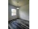 Bright room featuring hardwood floors, natural light, and neutral paint at 3858 Sw 161St St, Ocala, FL 34473