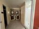 Bathroom with dual sinks, decorative wallpaper, a walk-in shower, and neutral tiling at 3950 Sw 54Th Ct, Ocala, FL 34474