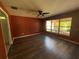 Bright bedroom with a ceiling fan and a large window providing ample natural light at 3950 Sw 54Th Ct, Ocala, FL 34474