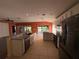 Open kitchen featuring stainless steel appliances, granite countertops, and an open view to the spacious living room at 3950 Sw 54Th Ct, Ocala, FL 34474
