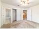 Bedroom with doorway to bathroom, closet, and doorway to another room at 4094 Sw 51St Ct, Ocala, FL 34474