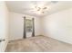 Bedroom with carpet, ceiling fan, and a window overlooking the neighborhood at 4094 Sw 51St Ct, Ocala, FL 34474