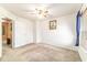 Neutral bedroom with ceiling fan, neutral carpet, and natural light at 4094 Sw 51St Ct, Ocala, FL 34474
