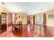 Spacious dining room featuring hardwood floors, traditional decor, and ample natural light from multiple windows at 4094 Sw 51St Ct, Ocala, FL 34474