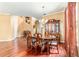 Formal dining room featuring hardwood floors, a chandelier, and classic wooden furniture at 4094 Sw 51St Ct, Ocala, FL 34474