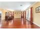 Expansive dining room with hardwood floors, a dining table, natural lighting, and traditional design elements at 4094 Sw 51St Ct, Ocala, FL 34474