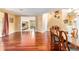 Well-lit dining space featuring hardwood floors, stylish decor, and open access to the living area at 4094 Sw 51St Ct, Ocala, FL 34474