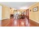 Open dining area featuring hardwood floors, elegant decorations, and seamless flow to the living spaces at 4094 Sw 51St Ct, Ocala, FL 34474