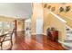 Dining room with hardwood floors adjacent to stairs and living area at 4094 Sw 51St Ct, Ocala, FL 34474