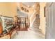 Spacious foyer with staircase, tile flooring, and view to dining room at 4094 Sw 51St Ct, Ocala, FL 34474