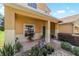 Inviting front porch with tiled flooring and decorative plants at 4094 Sw 51St Ct, Ocala, FL 34474
