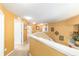Hallway upstairs with railing overlooking the stairs with access to bedrooms at 4094 Sw 51St Ct, Ocala, FL 34474