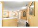 Upstairs hallway features warm colors, carpet flooring, and multiple doorways at 4094 Sw 51St Ct, Ocala, FL 34474